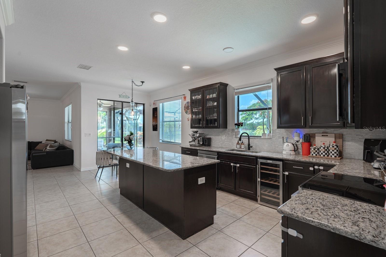 Oversized cabinets and wine cooler.