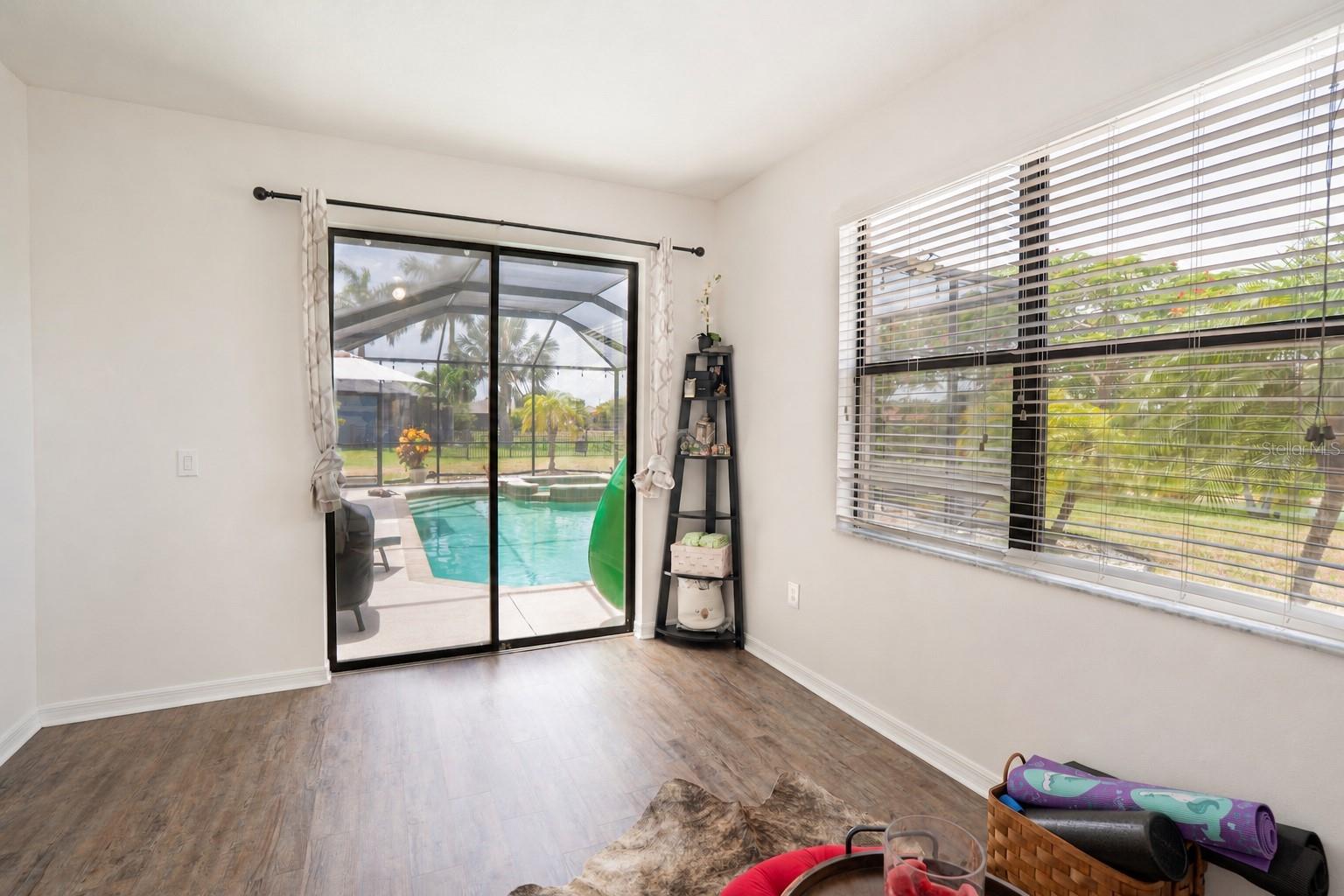 Sliding doors opening to the pool.