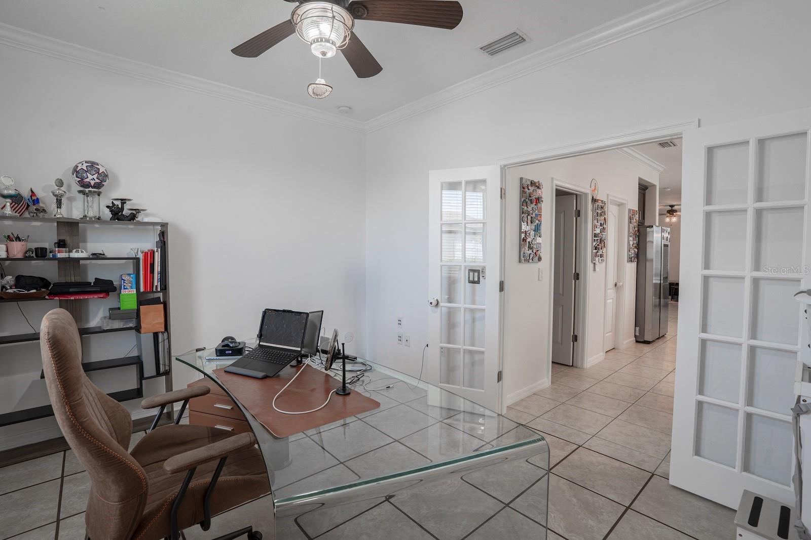 Double glass doors opening to kitchen and living space.