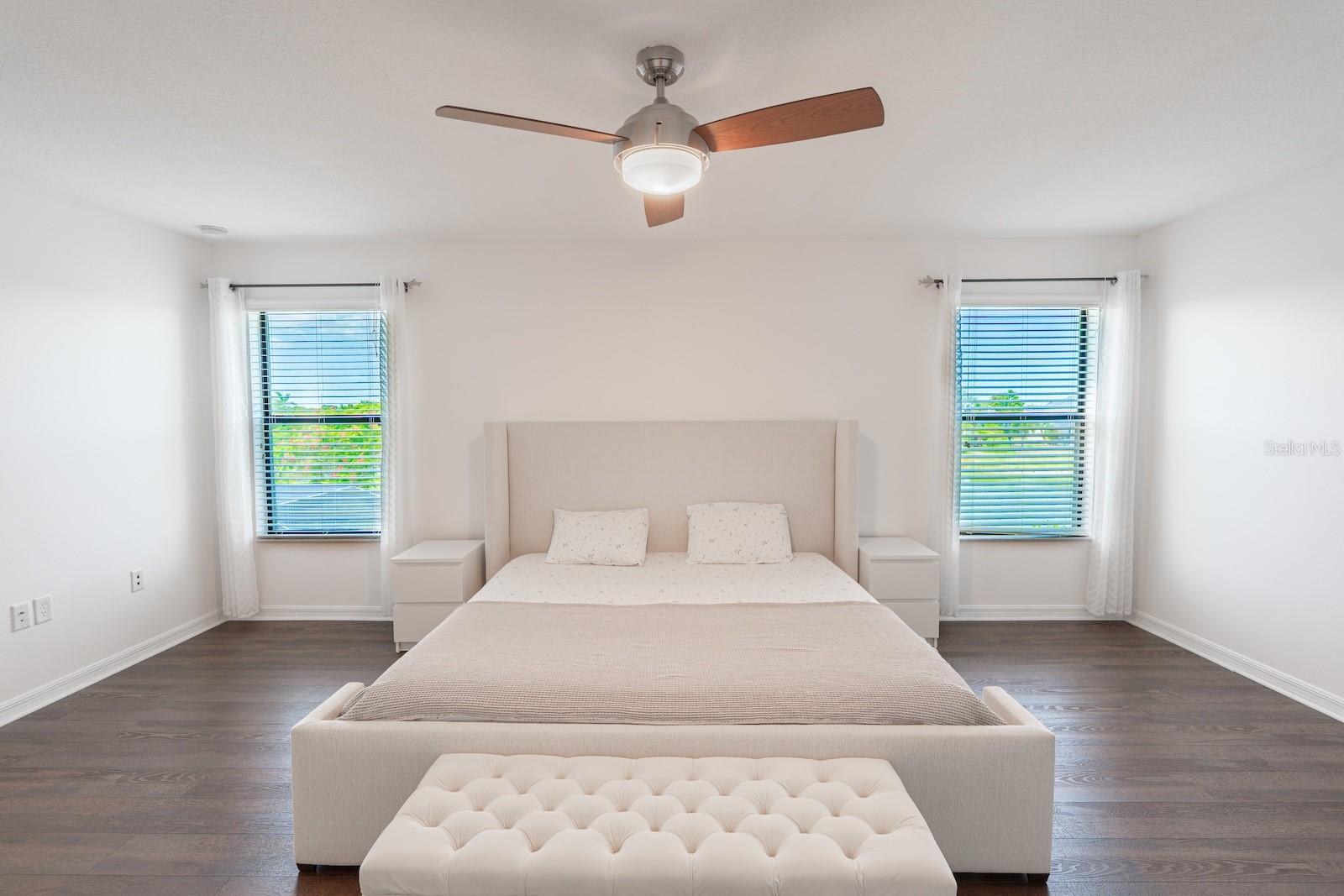 Large, spacious primary suite featuring beautiful views of the pool and the pond.