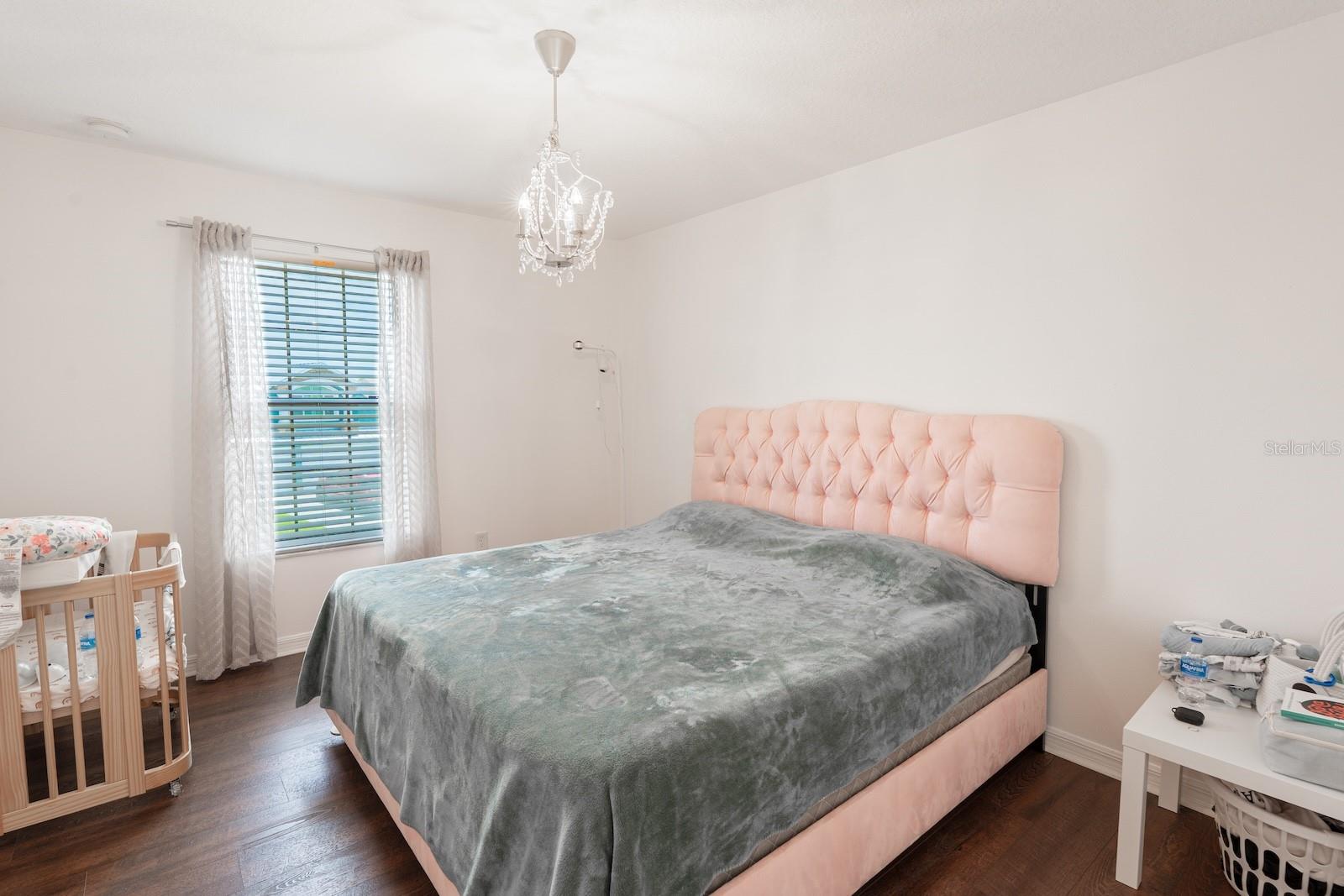 This bedroom features an en-suite bathroom and a spacious walk-in closet.