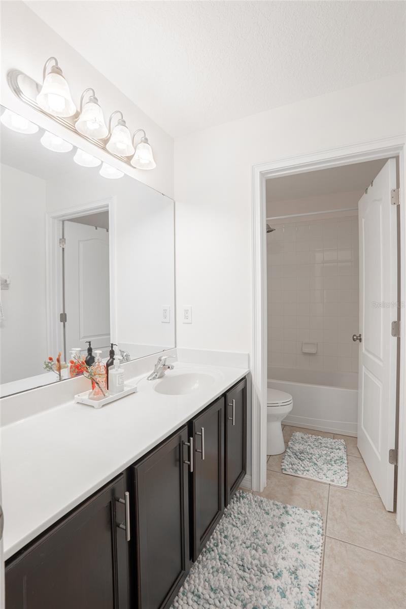 Shared full bathroom upstairs.