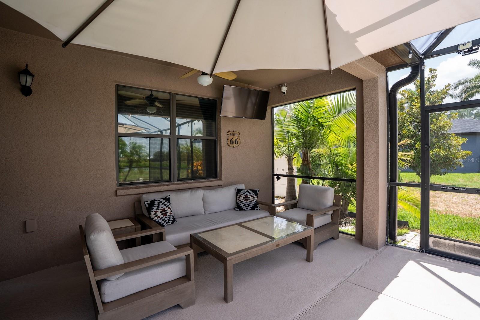 Covered outdoor patio area, perfect for year-round entertaining and relaxing.