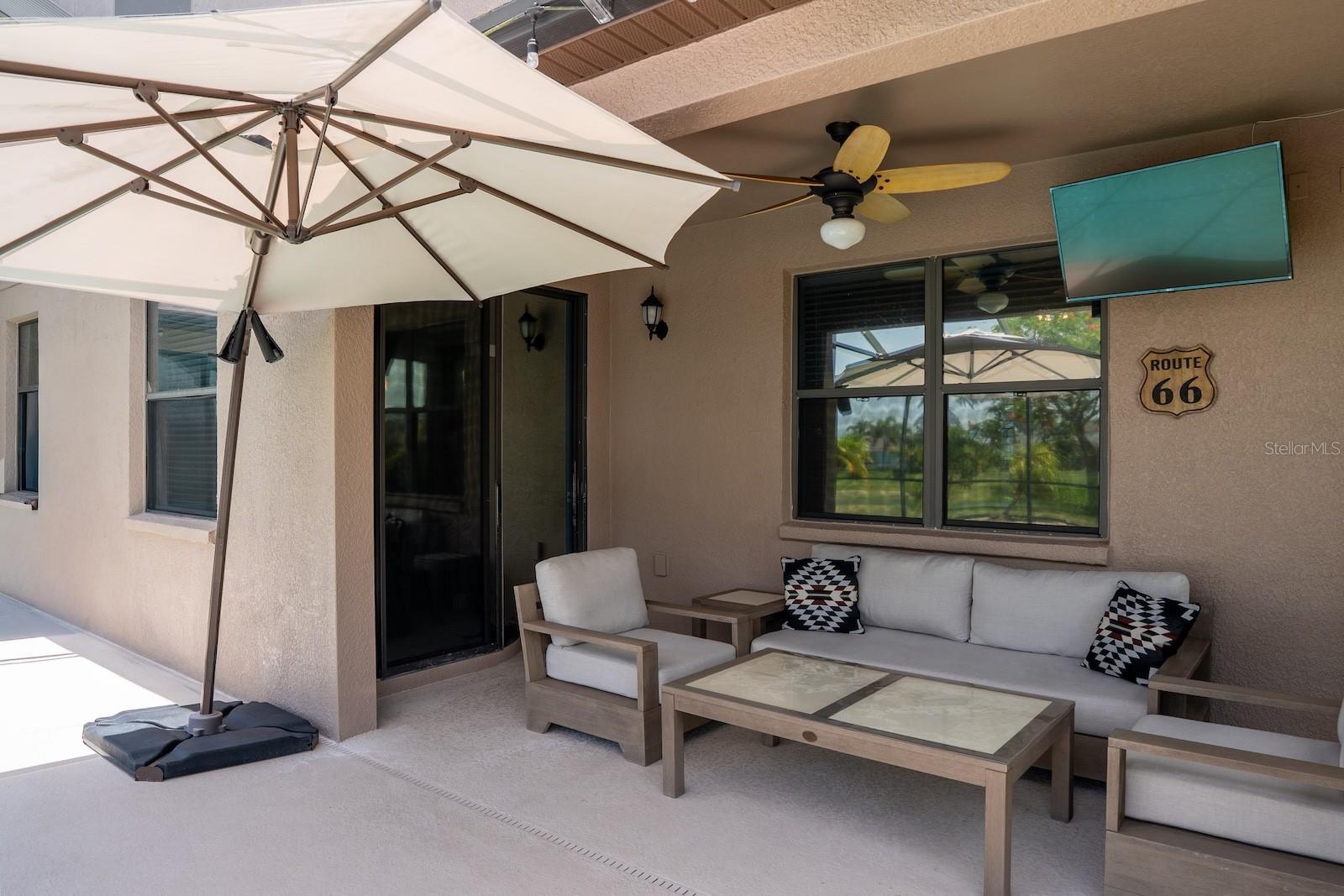 Covered outdoor patio area, perfect for year-round entertaining and relaxing.