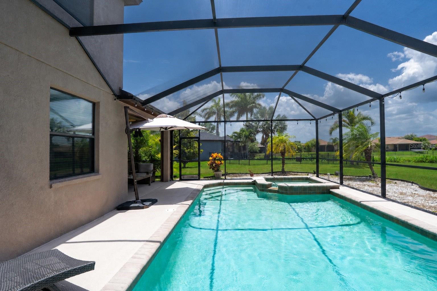 Screened in heated pool & spa.