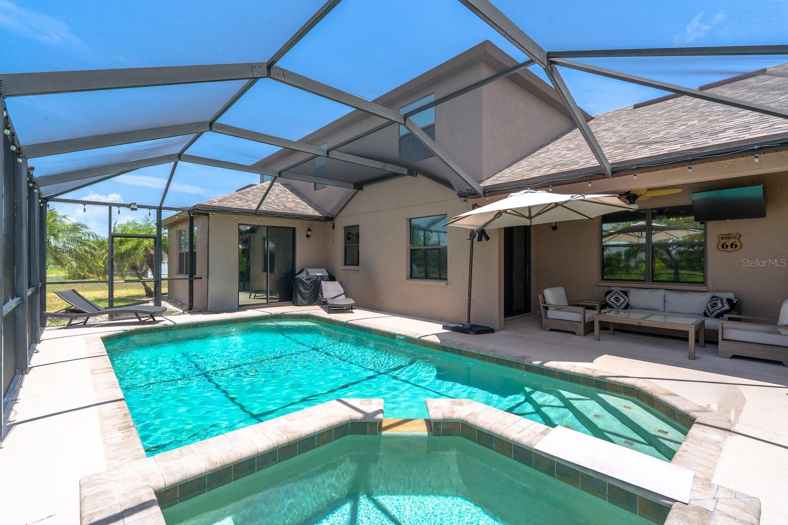 Screened in heated pool & spa.