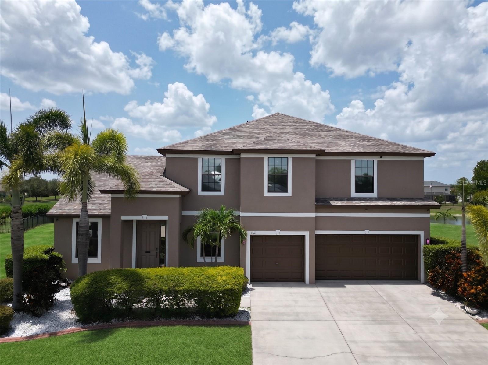 Stunning curb appeal featuring beautifully maintained landscaping and inviting exterior charm.