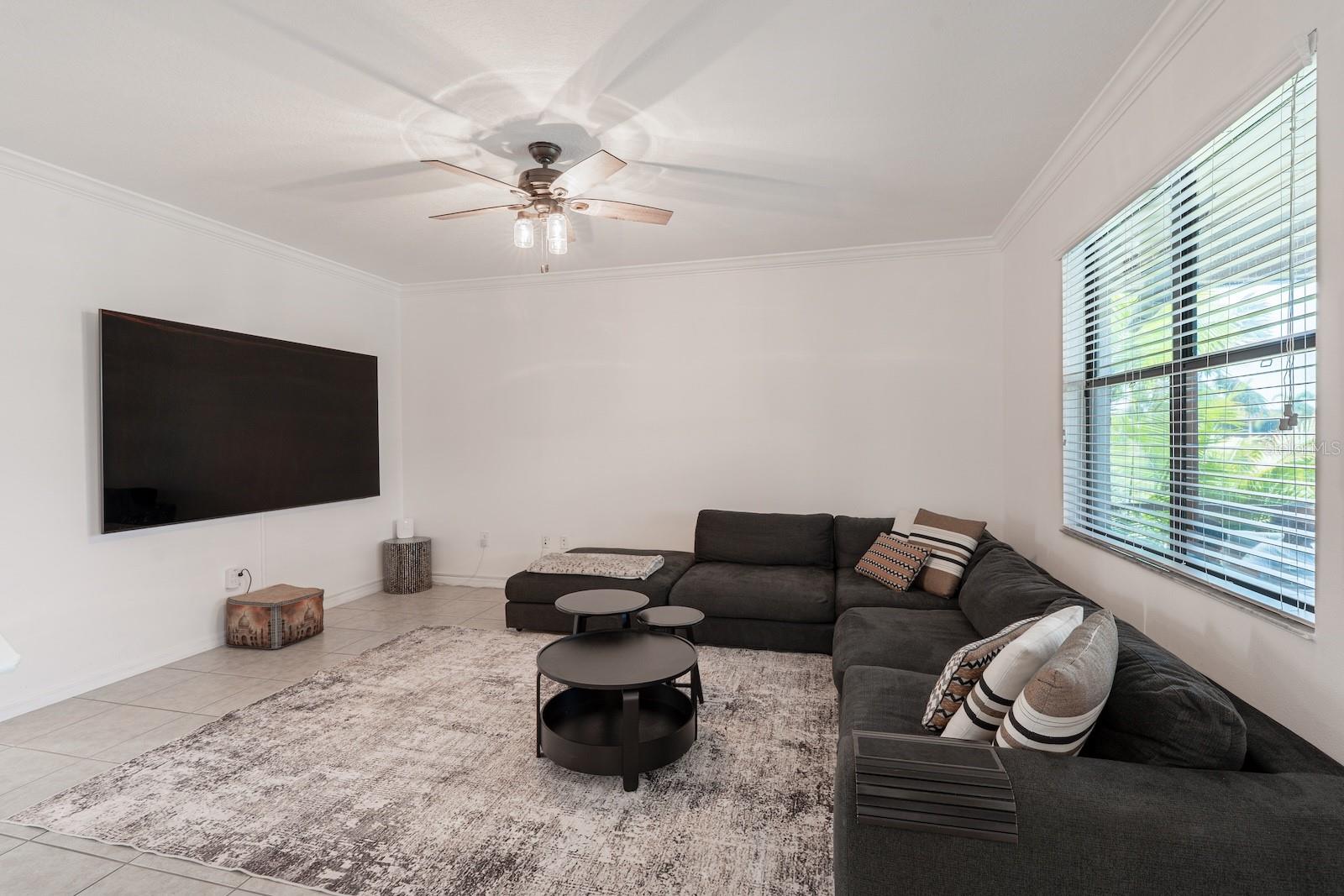 Family room featuring a scenic view of the pool and backyard.