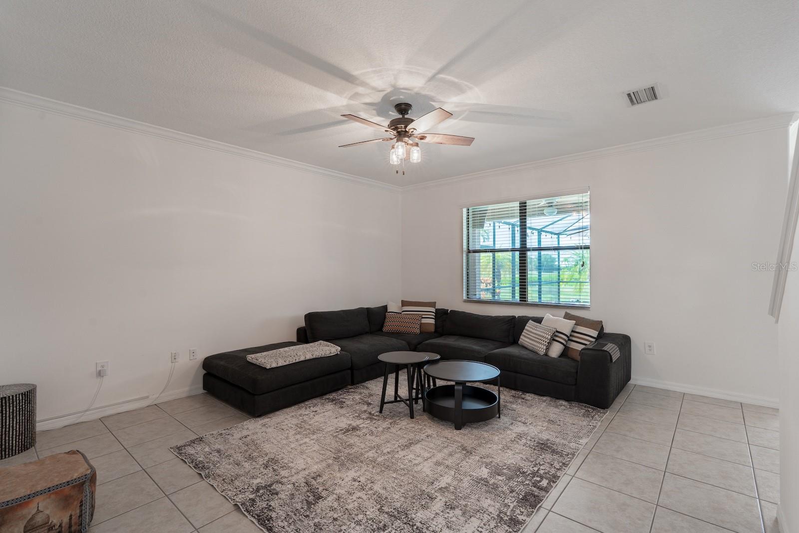 Family room featuring a direct view of the pool and backyard.