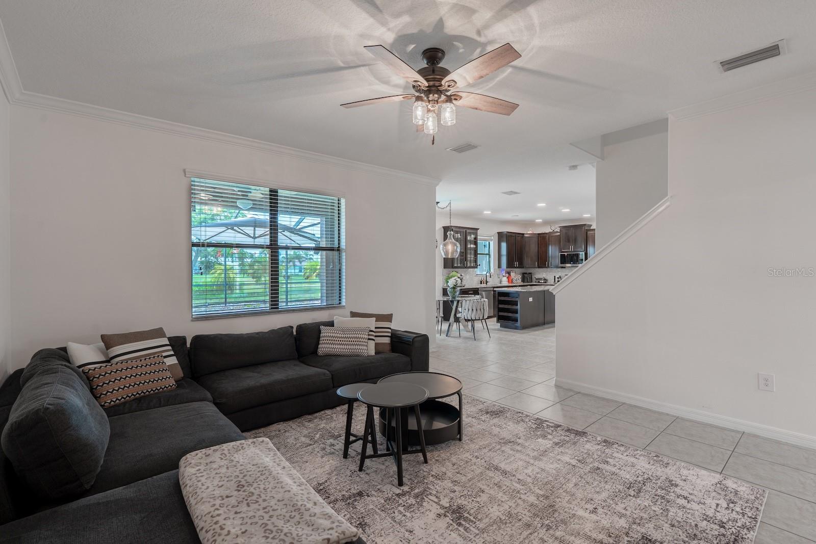 Family room showcasing a view of the pool and backyard.