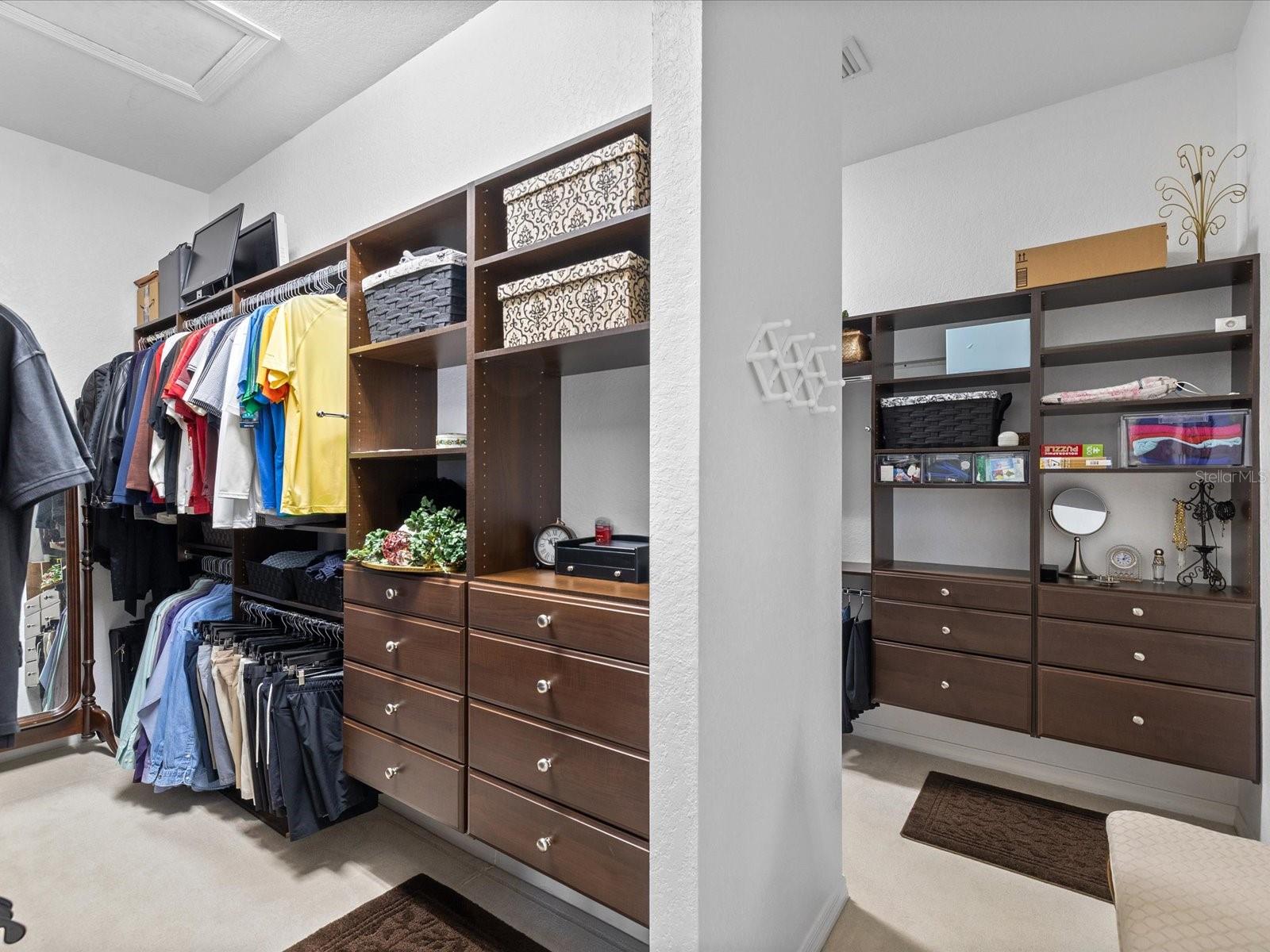 Walk in closet with custom his and her sides