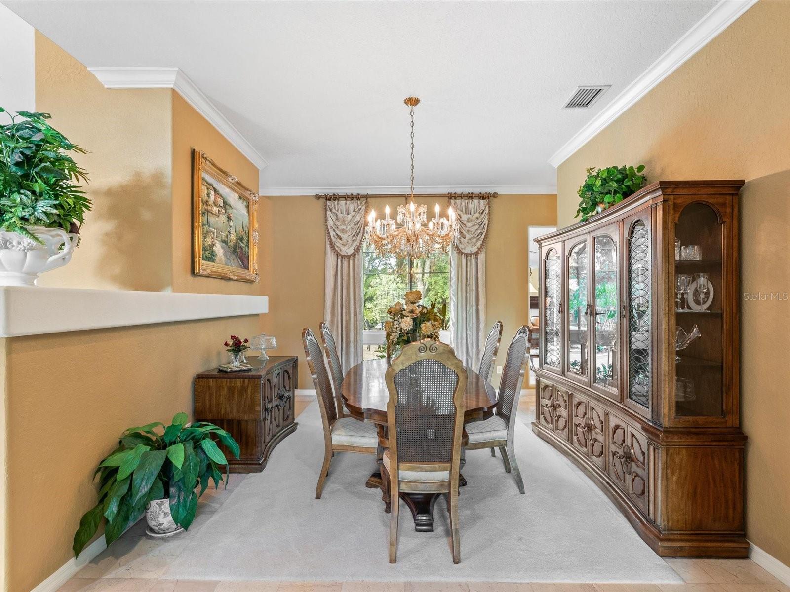 Formal dining with a view of the courtyard and pond