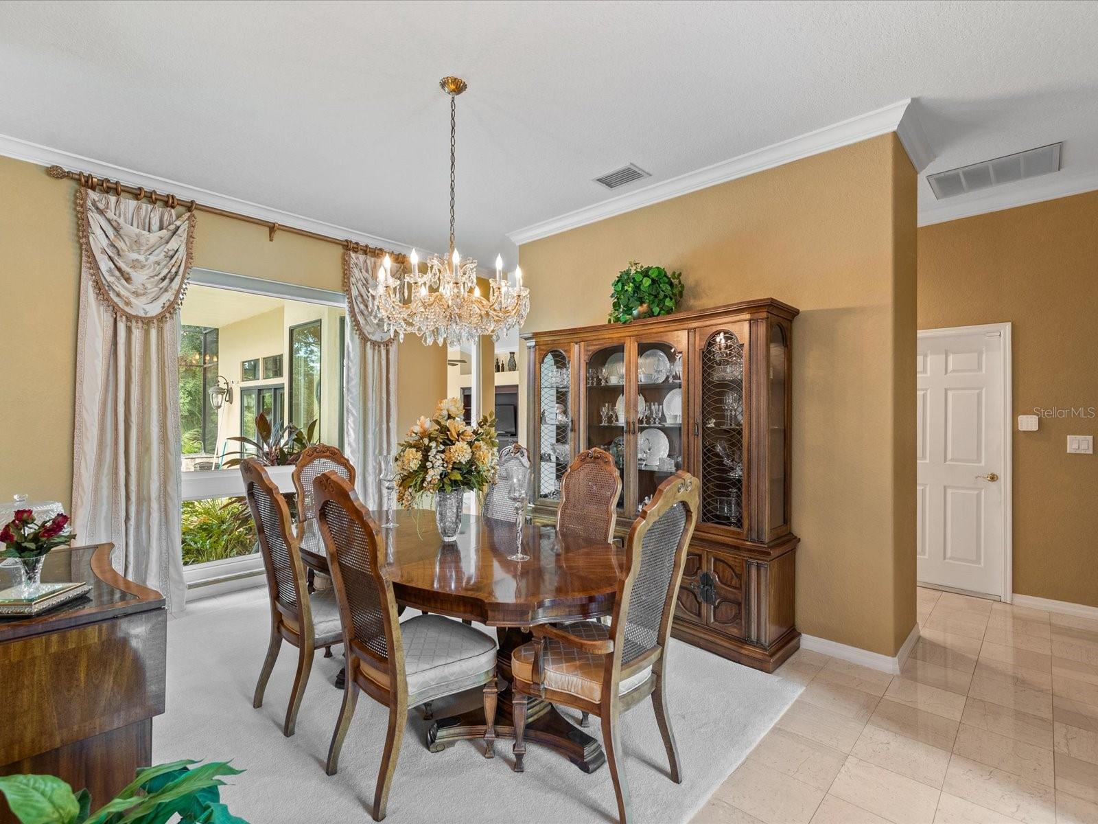 Formal dining with a view of the courtyard and pond