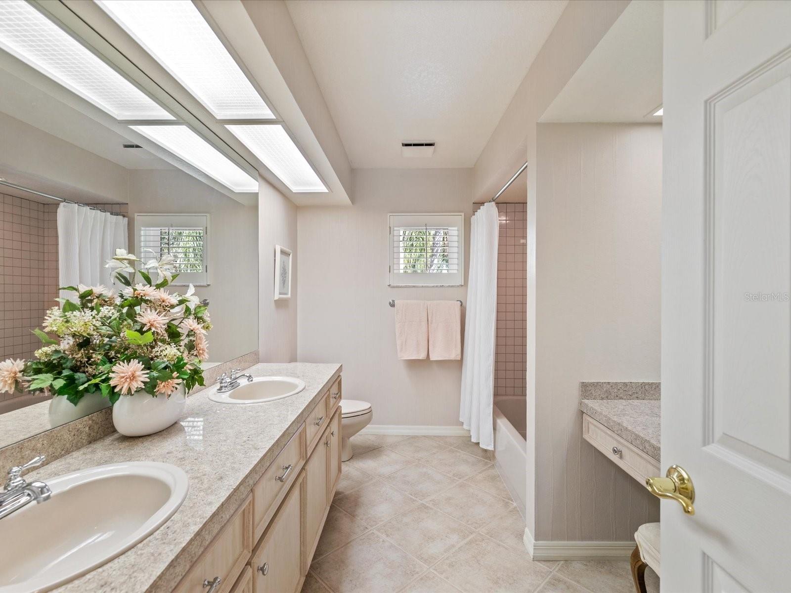 Dual sinks with vanity between bedrooms 2 and 3
