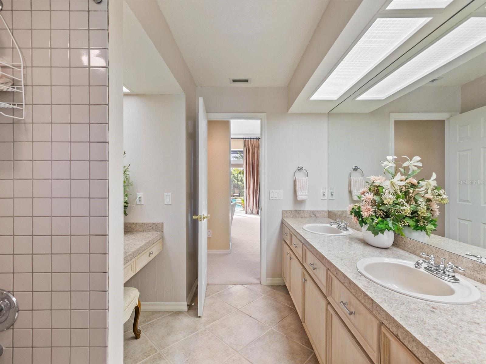 Dual sinks with vanity between bedrooms 2 and 3