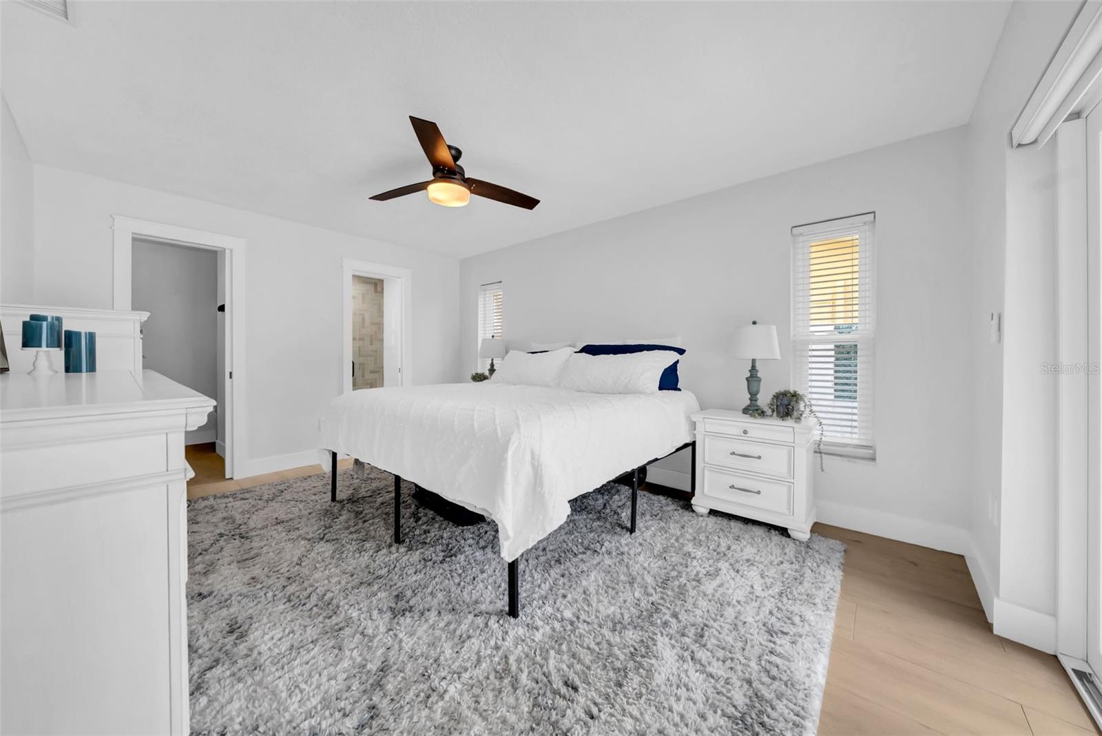 Primary with walk in closet and en suite bathroom.