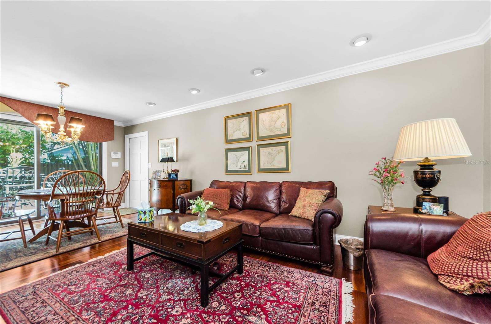 Den also opens to the back paved patio and the garden areas.  Such a wonderful extra space with so much light!