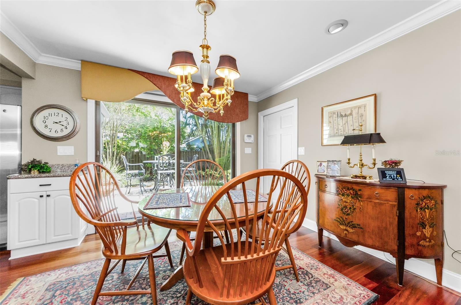 Note the beautiful floors, the chandelier and the custom window treatments.  They all convey with the property!