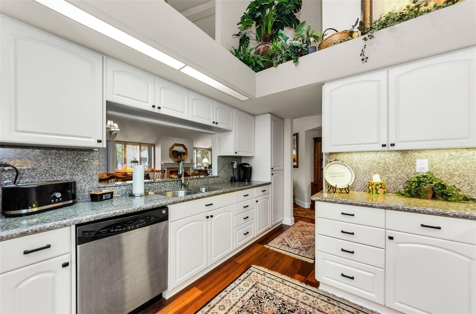 Spacious kitchen overlooking the formal dining and adjacent to the den.