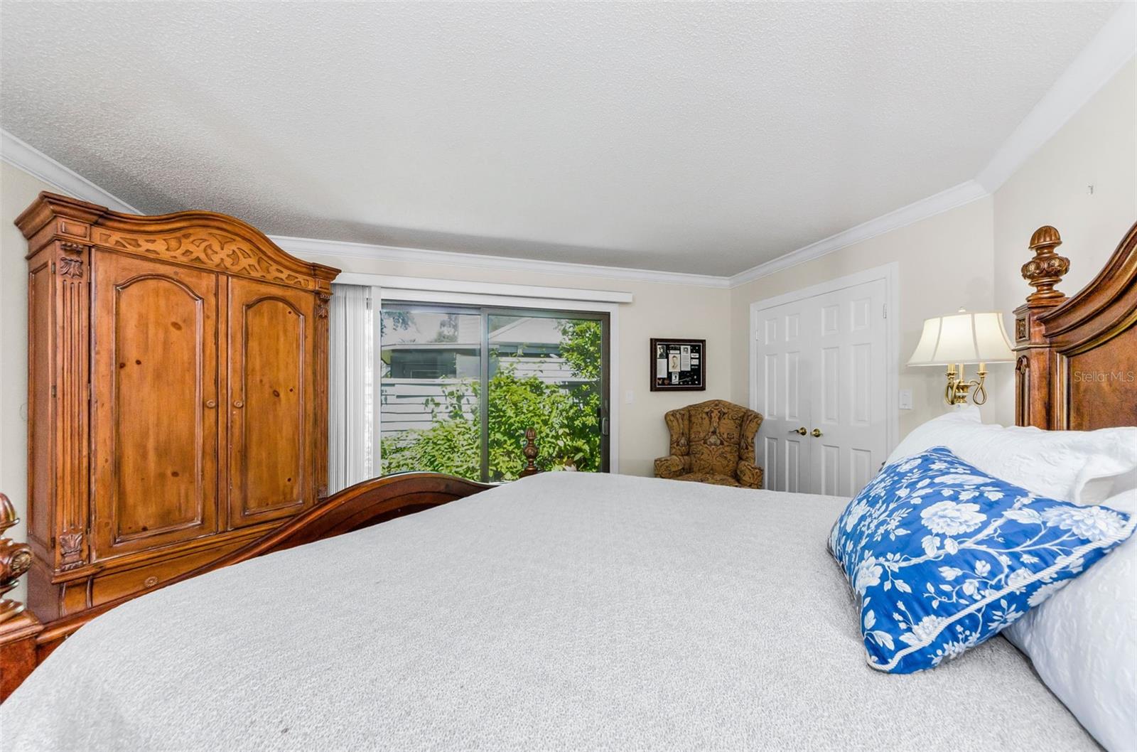 Master bedroom view out to the back pation and the double doors on the right are the walk in closet.