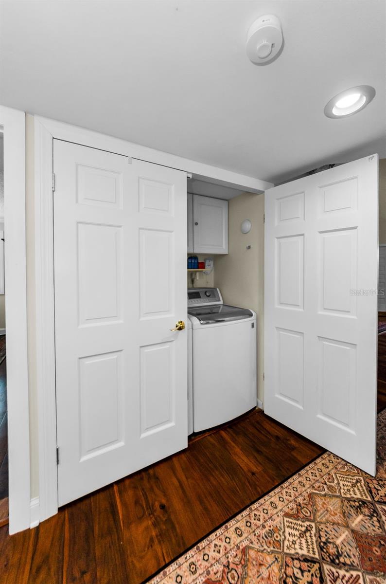 Full sized laundry closet outside the bedrooms.