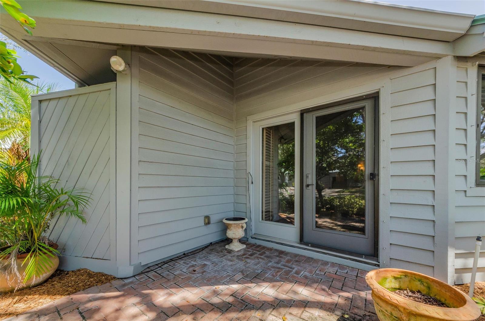 Brick paved patio with french doors to the living room!