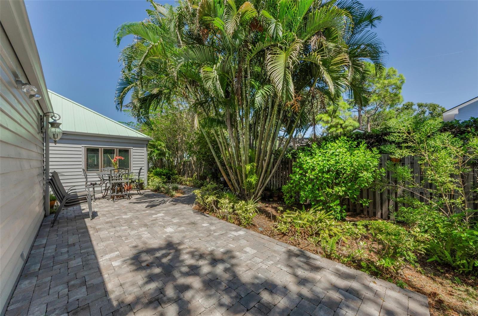 The patio extends along the back of the 2 car garage as well!