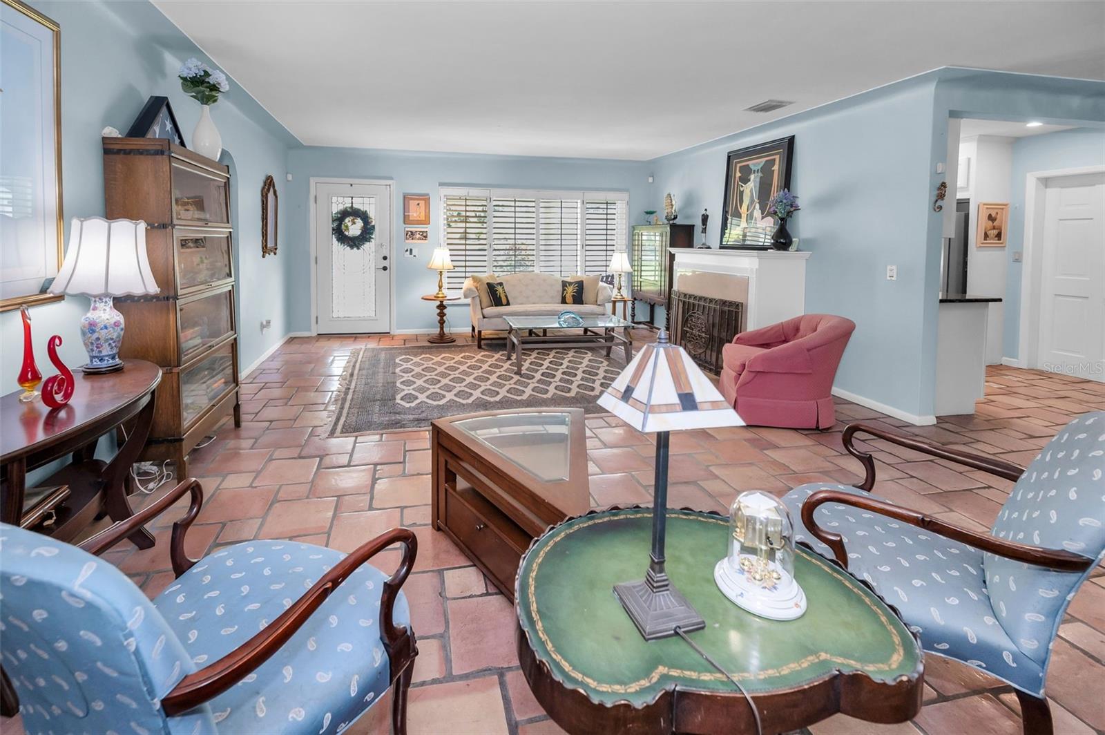 A spacious, open-concept Living area offers the perfect blend of comfort and charm