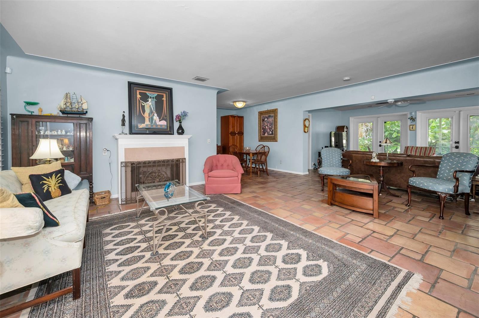 The open Living area features a welcoming Fireplace