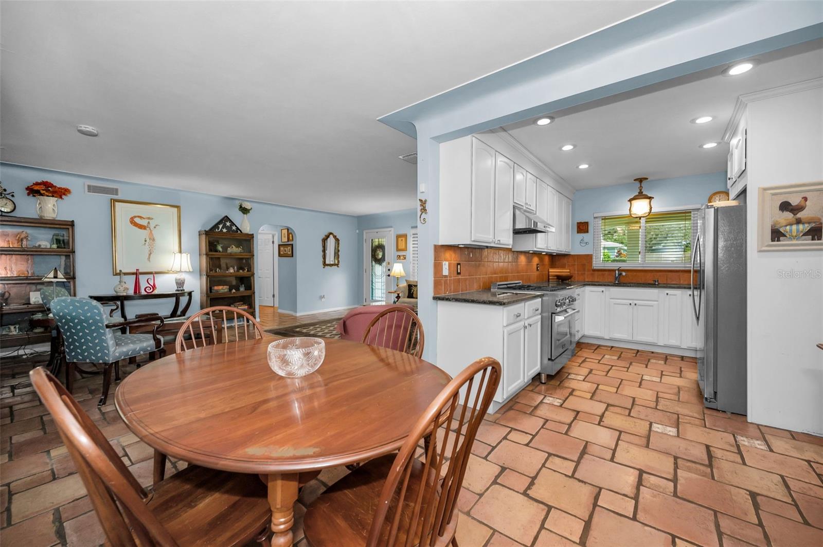 Bright and welcoming, the everyday dining area invites conversation, comfort, and connection