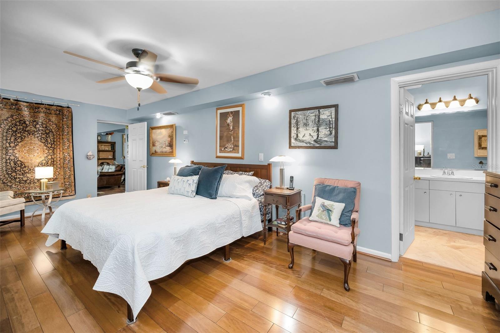 The spacious primary suite offers a peaceful retreat with room to relax, recharge, and reconnect