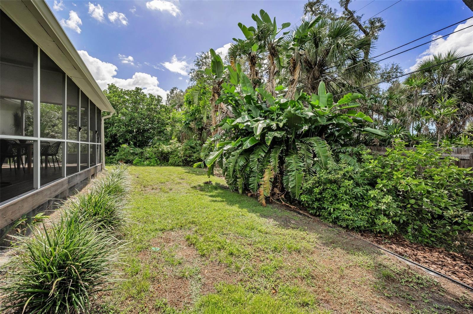 Outside, the fenced backyard is a true oasis!