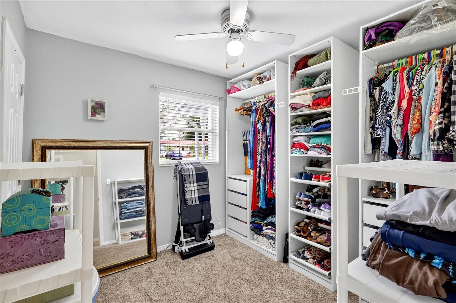 Third bedroom with a closet is currently used as a dressing room.  Seller will consider leaving the closet storage pieces.