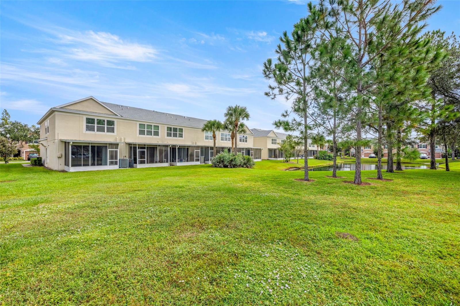 End unit with green space and pond