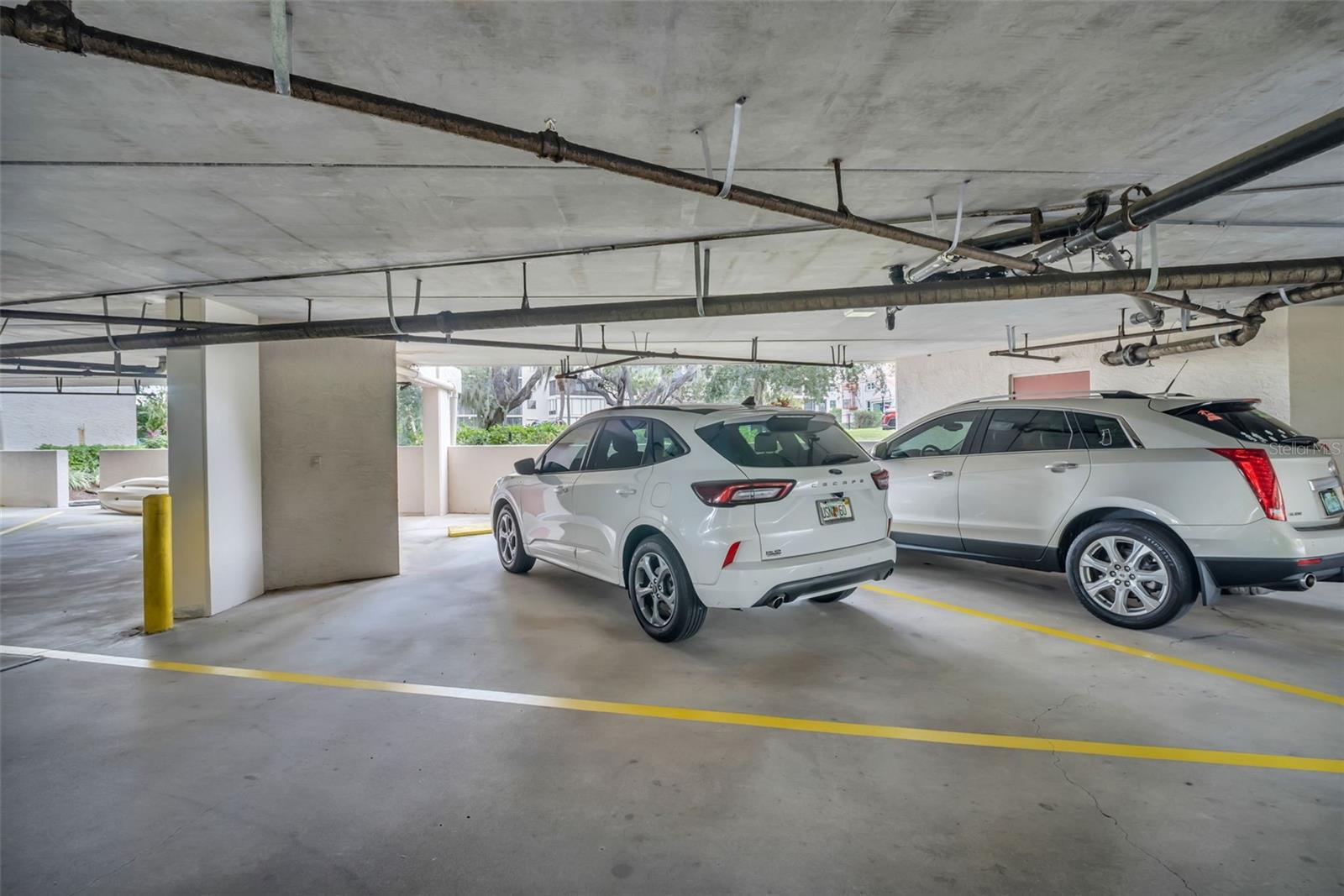 COVERED PARKING WITH STORAGE UNIT UNDER BUILDING. NO WATER ENTERED LAST YEAR!