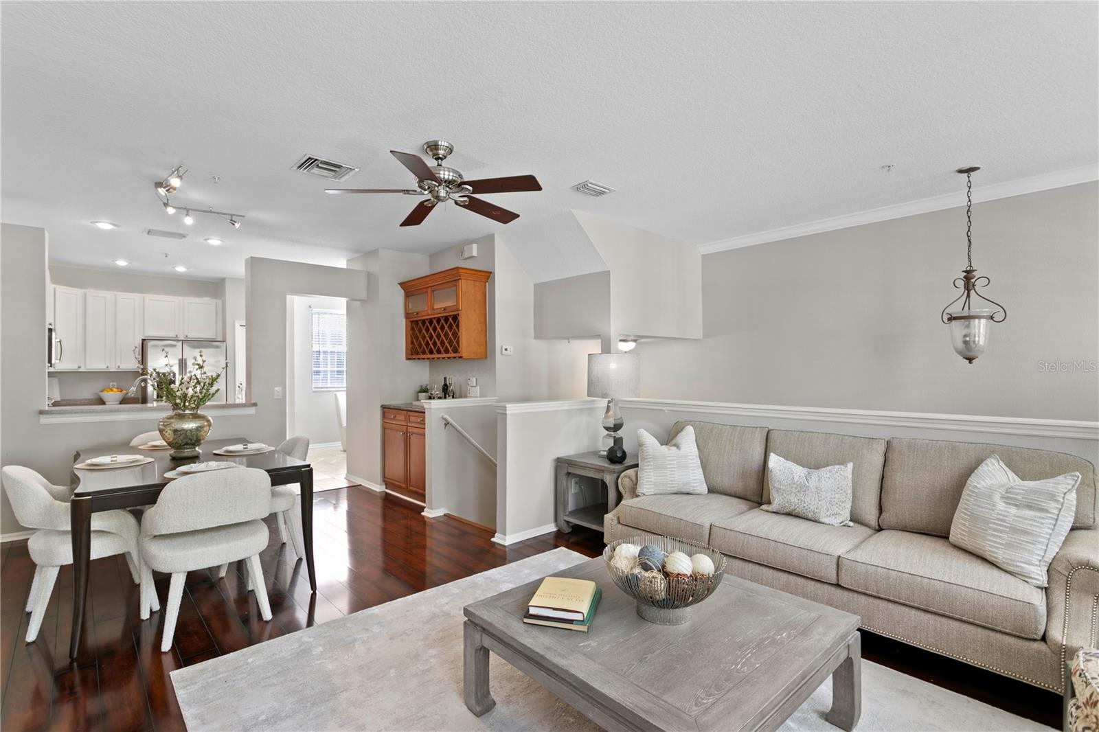 Inside, theopen-concept layout flows effortlessly between the expansive living and dining areasand a well-appointed eat-in kitchen featuring abundant cabinetry and prep space.