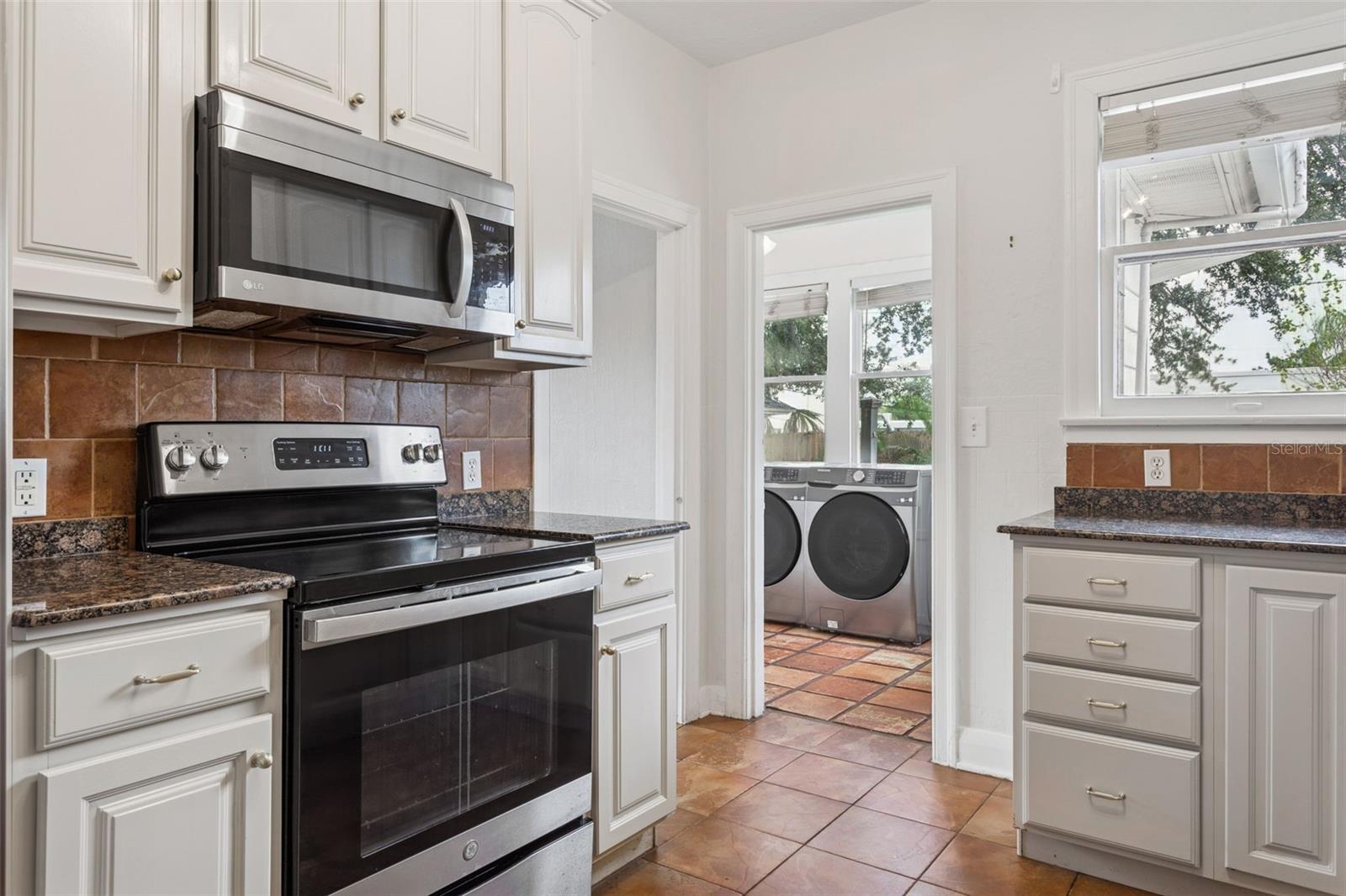 Kitchen with view of laundry room