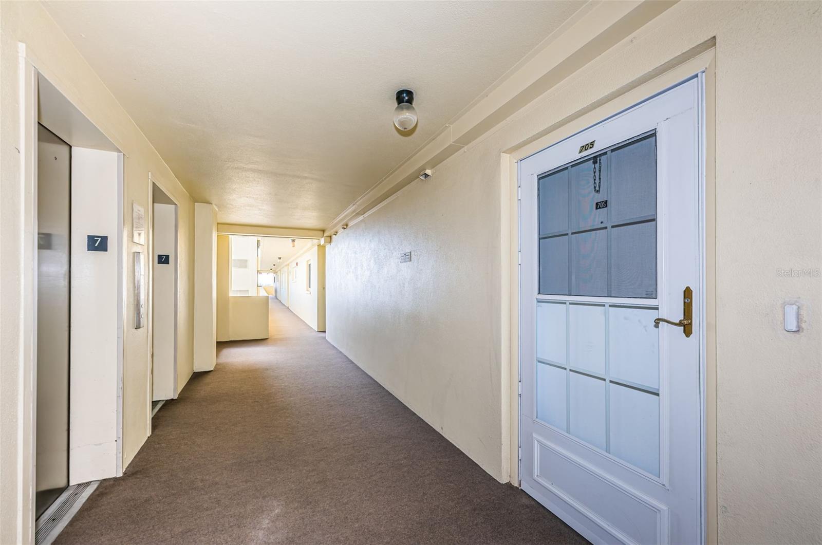 Condo right across from the elevator and laundry room