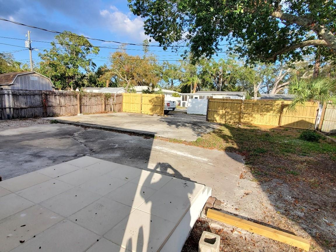BACKYARD AND CEMENT PARKING SPACES