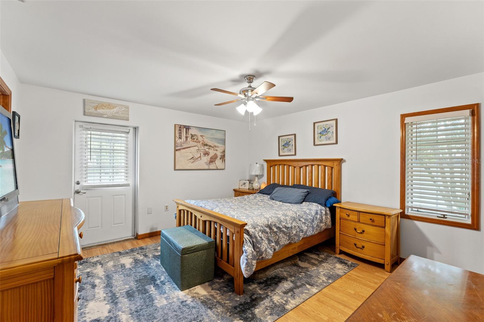 Primary Bedroom with Door to Pool Area