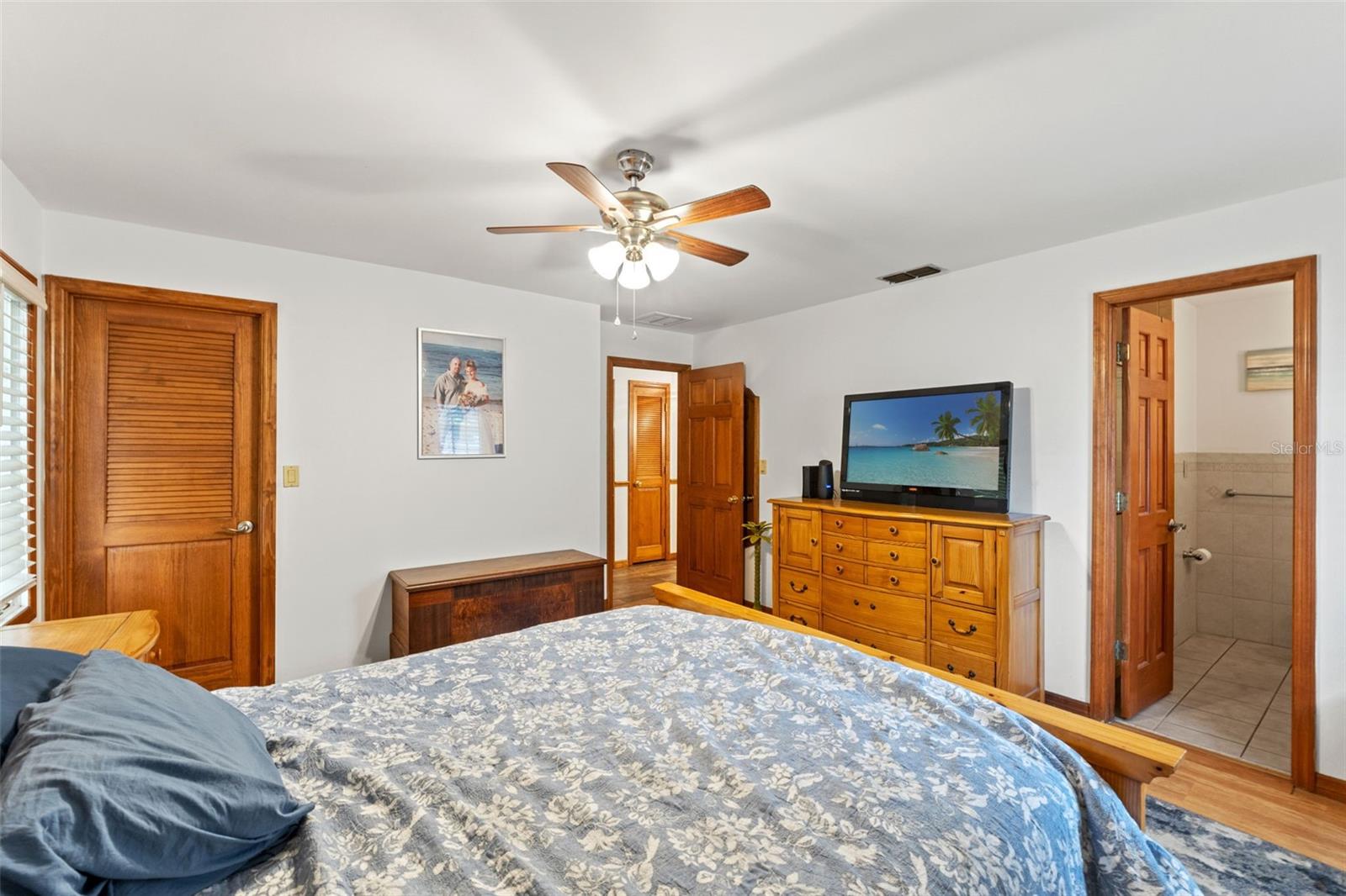 Primary Bedroom with Door to Walk in Closet & Bathroom