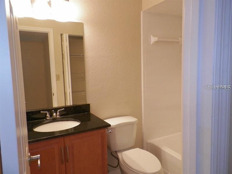 Tub with overhead shower