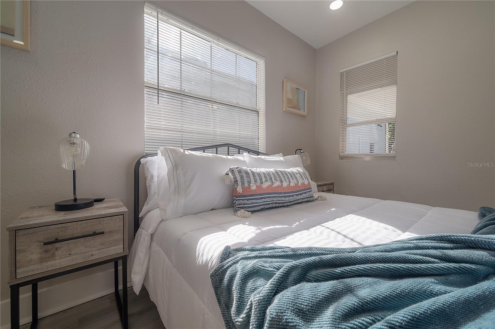 photos of downstairs  bedroom from when the home was previously an airbnb