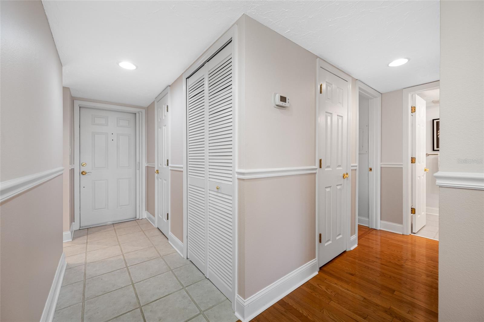 Hallway direct from the foyer leads to bedrooms and baths