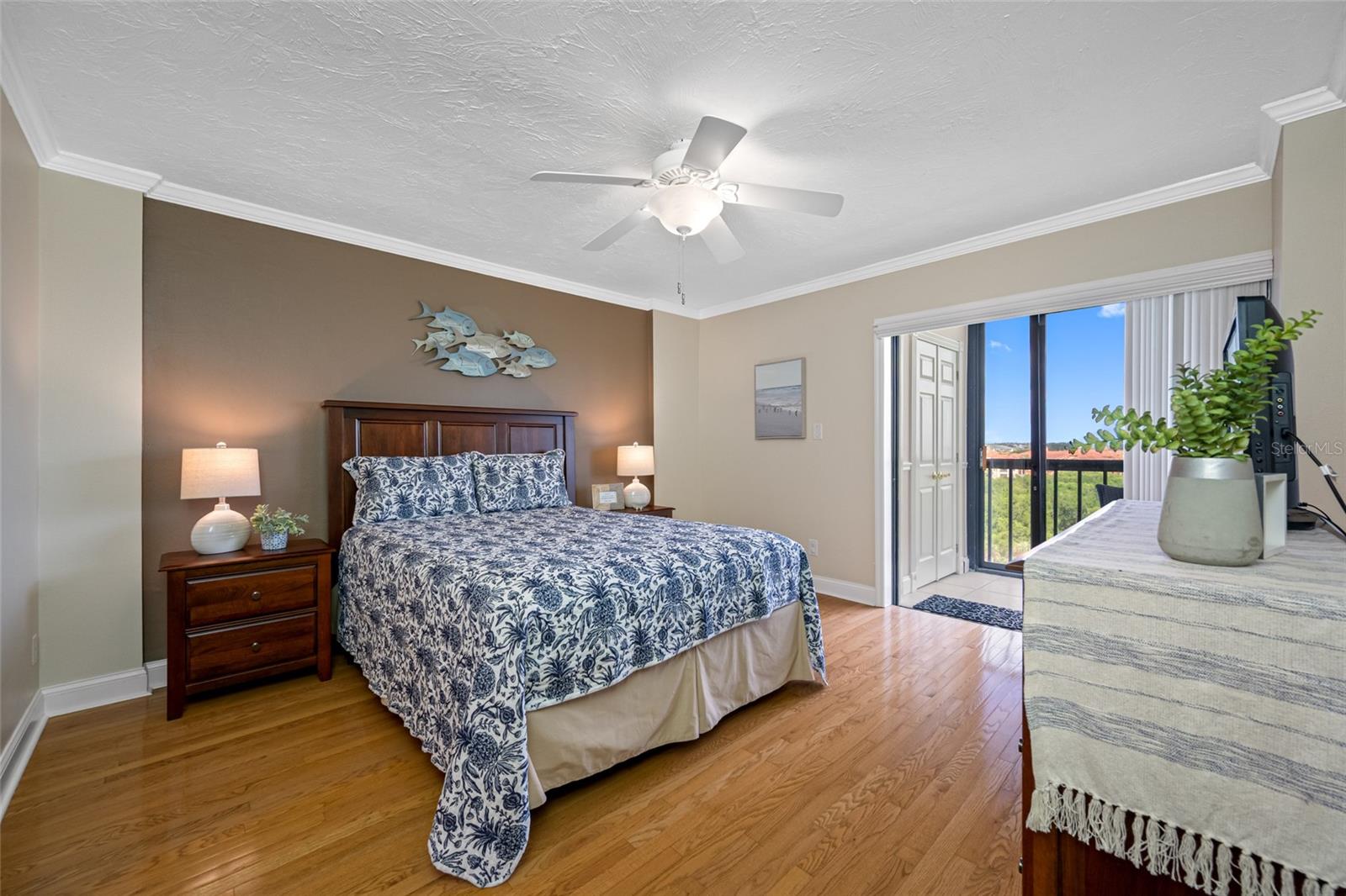 Primary Bedroom with view of Tampa Bay direct in the morning as you awake.  Lanai access via bedroom sliding doors