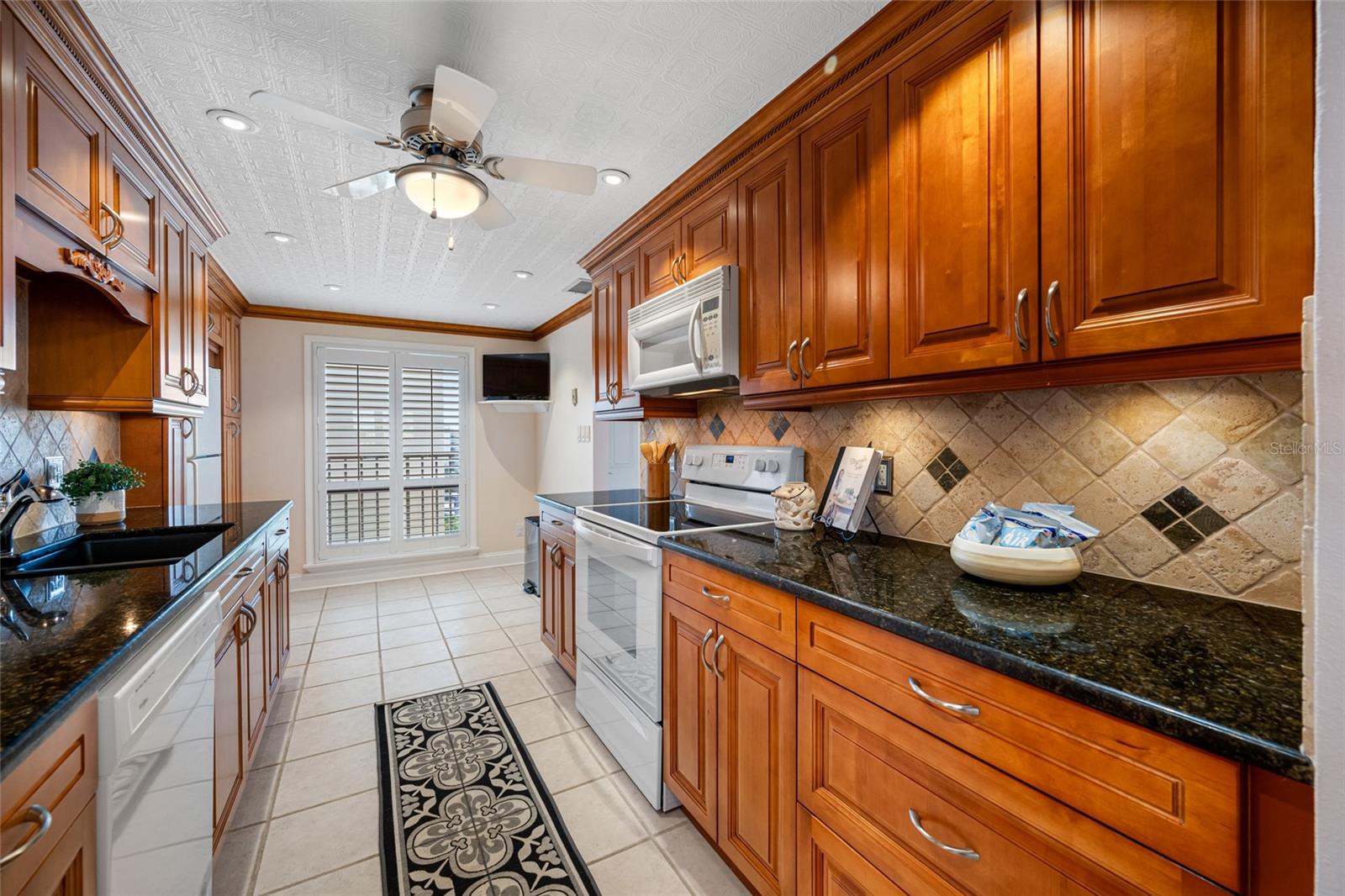 Kitchen with range and build-in microwave
