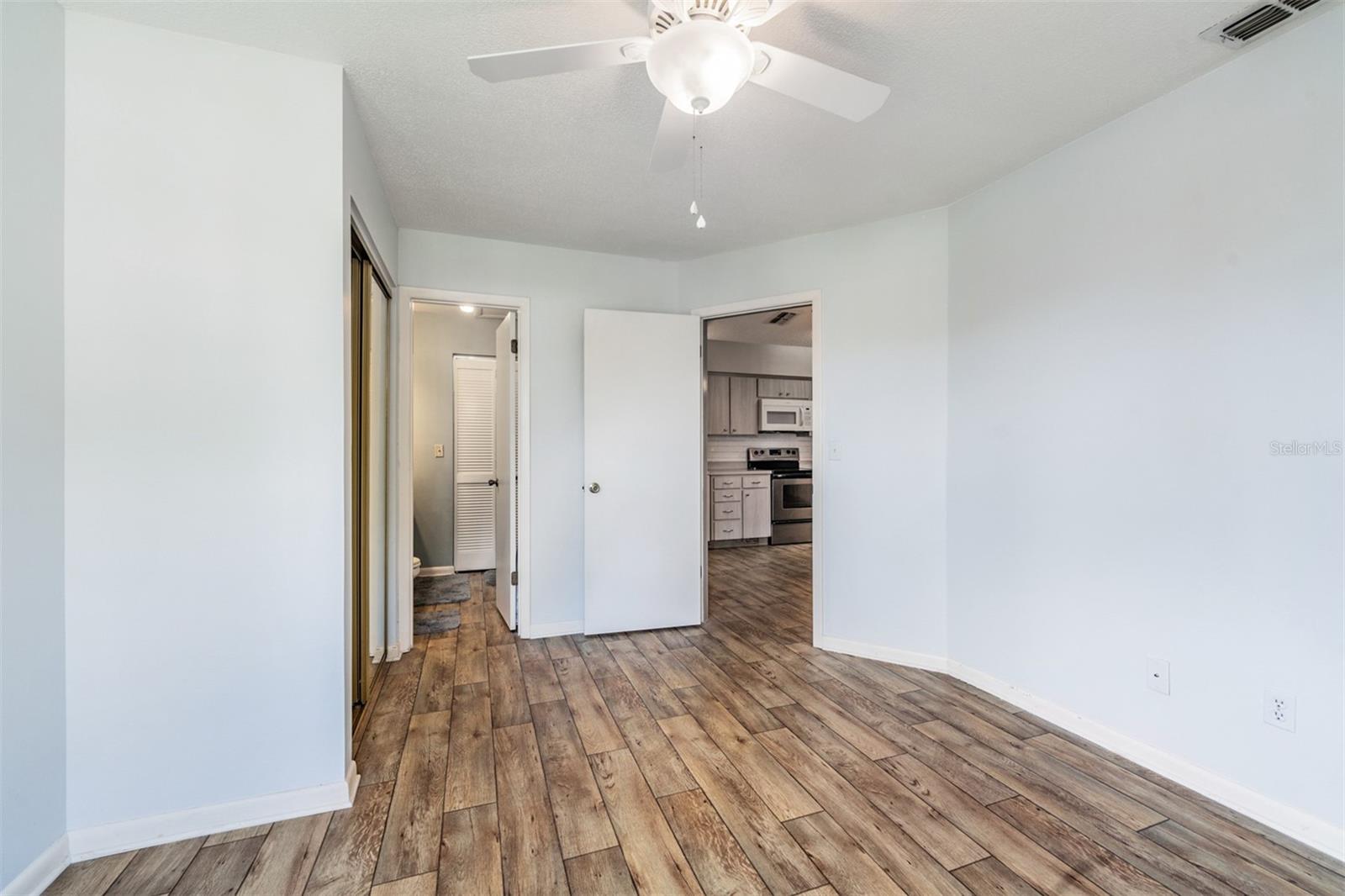 Master Bedroom, Laminate Flooring, Ceiling Fan and Private Bathroom.