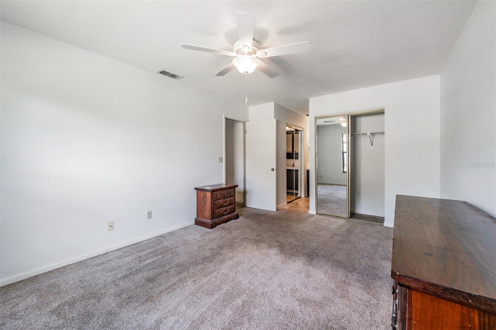 Guest Bedroom, Ceiling fan and private bathroom, there is a closet in the bedroom and the bathroom.