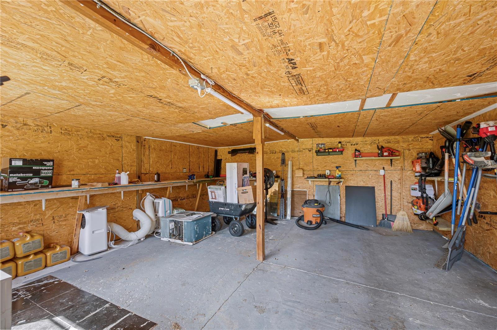 Inside the green storage shed