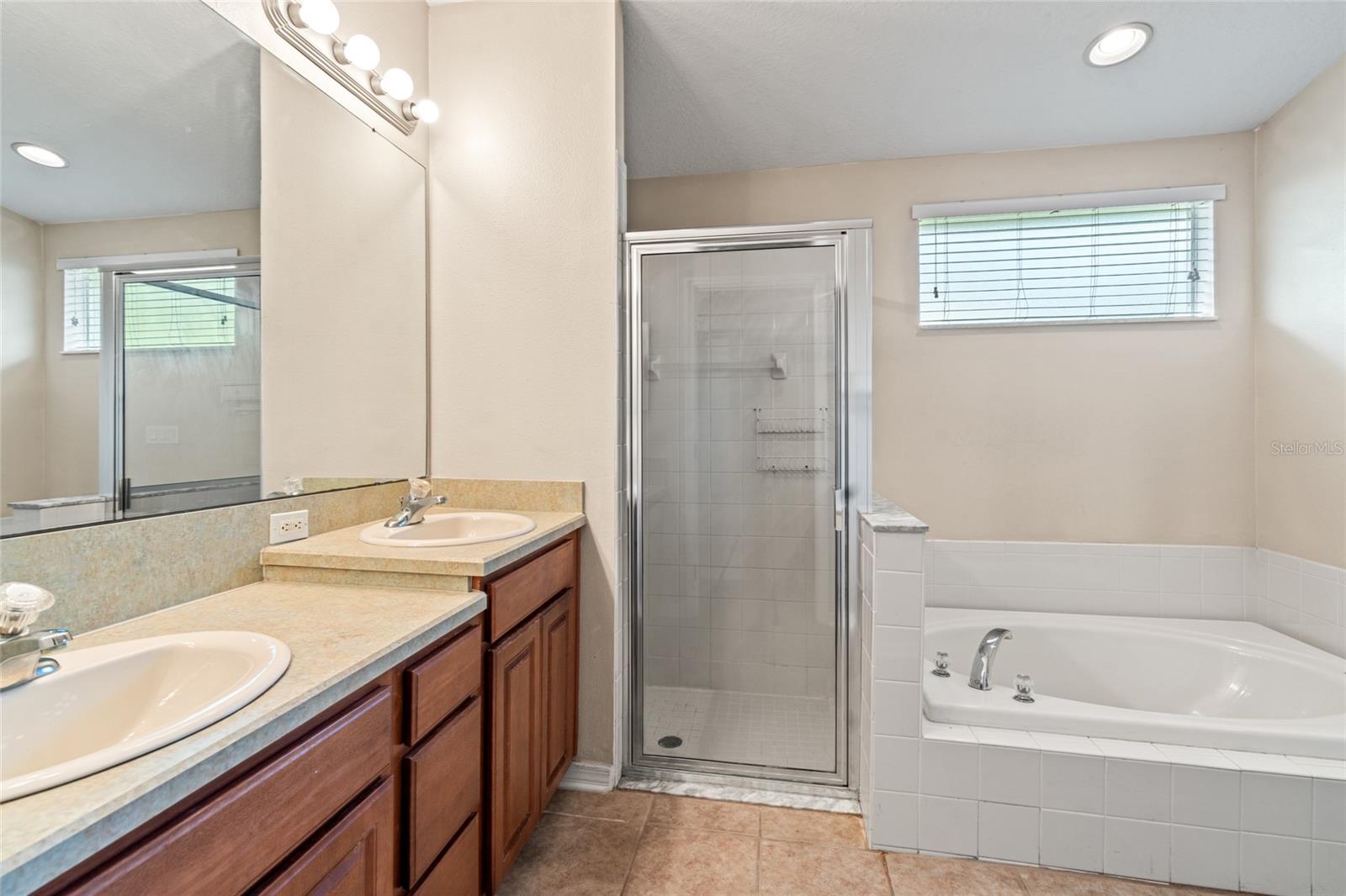 Primary Bathroom Dual Vanities, Shower and Garden Tub